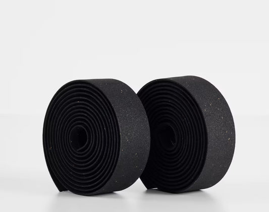Two rolls of black Trek gel cork bicycle handlebar tape on a white background.