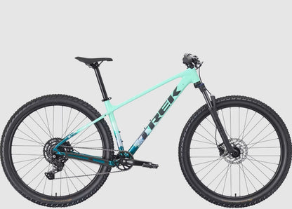 Trek seafoam green Marlin 5 bicycle with black components on a light gray background.