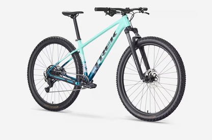 A seafoam green Trek Marlin 5 bicycle with black components on a white background.