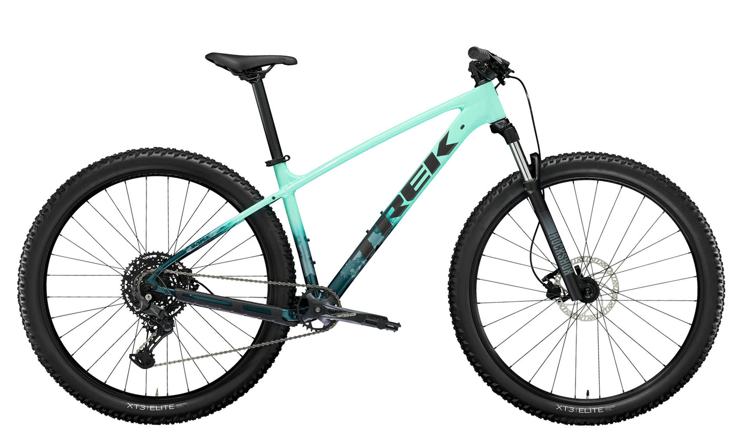A side view of the Trek Marlin 6 Gen 3 mountain bike in Miami Green to Dark Aquatic Fade. 