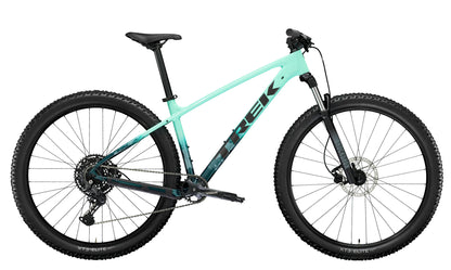 A side view of the Trek Marlin 6 Gen 3 mountain bike in Miami Green to Dark Aquatic Fade. 