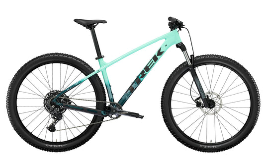 A side view of the Trek Marlin 6 Gen 3 mountain bike in Miami Green to Dark Aquatic Fade. 