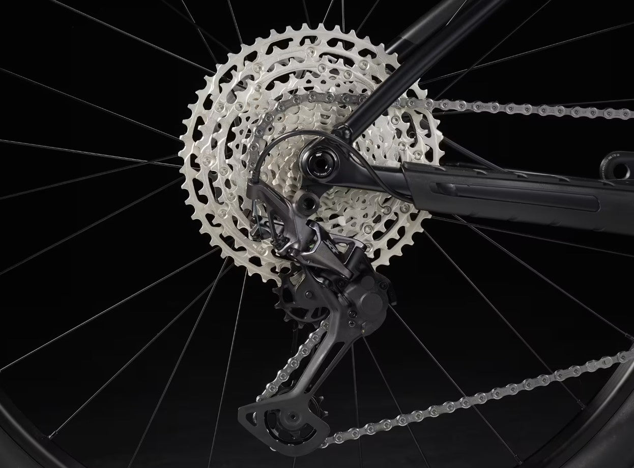 Close-up of a bicycle's gear system with a black background