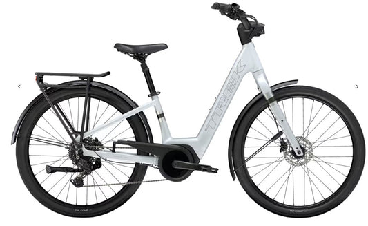 White Trek Verve Plus electric bicycle with black components on a white background