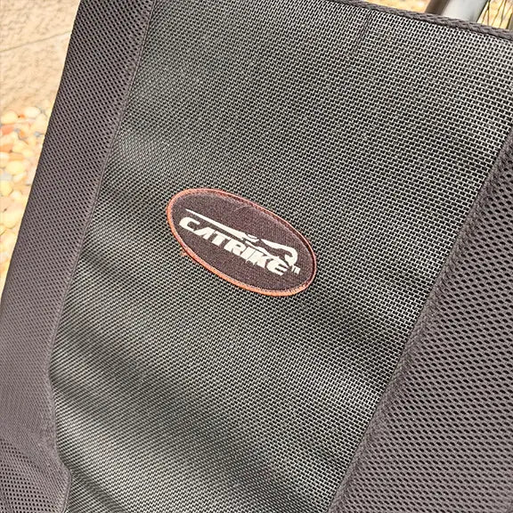 Closeup view of the seat on the Catrike Used 5.5.9 eCat Eon Green Recumbent Trike in an outdoor setting.