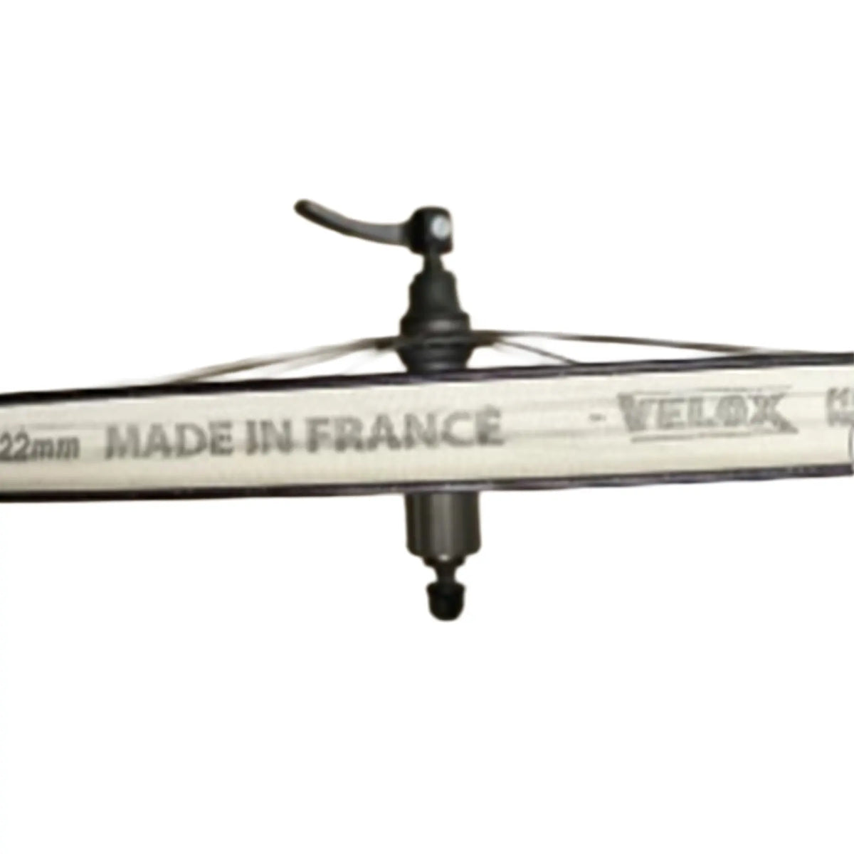 Closeup view of the Velox Single Roll Cloth Rim Tape in 22mm width off-white tape mounted on a bicycle wheel against a white background.