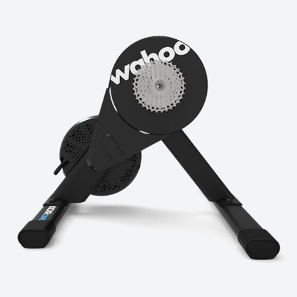 Side view with cassette of a Wahoo KICKR Core 2 black bike trainer against a white background.