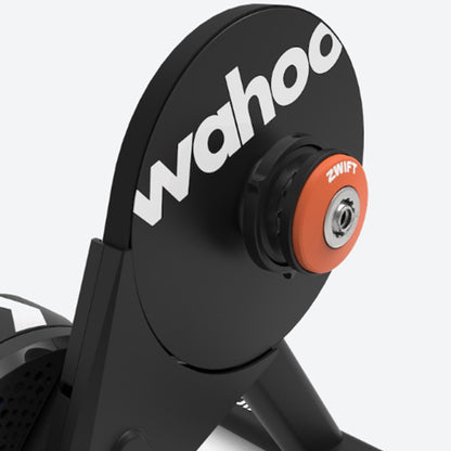 Closeup view of Wahoo KICKR Core 2 Smart Trainer with Zwift Cog and Click indoor cycling trainer against a white background.