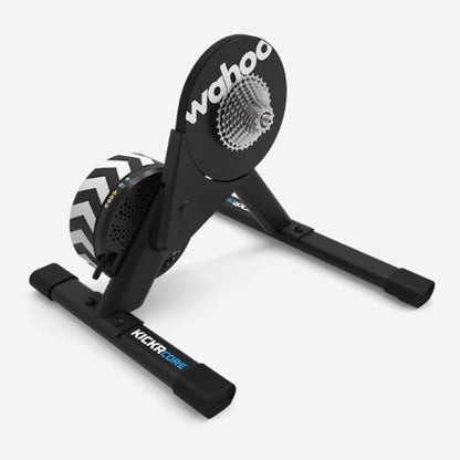 Angled view of a Wahoo KICKR Core 2 black bike trainer against a white background.