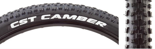 A black mountain bike tire with the text 'CST CAMBER' visible on the sidewall, featuring a tread pattern designed for off-road cycling.