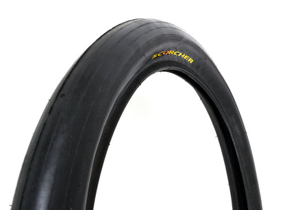 A black bicycle tire with the text 'SCORCHER' visible on its side.