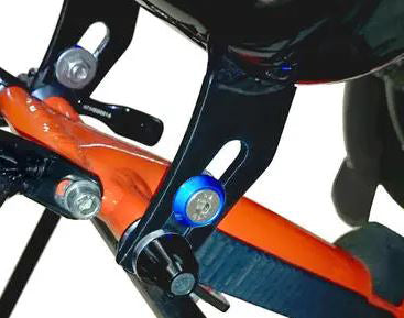 HP Velotechnik Adjustable End Stops pictured on the seat adjustment feature of an orange trike.