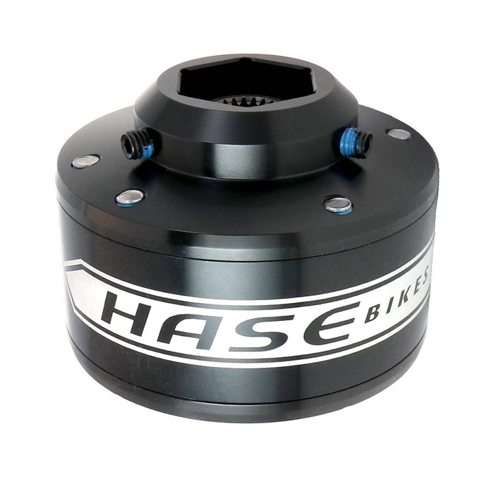 Studio view of a black Hase Trigo Differential with a white stripe around it that says Hase Bikes in black lettering. 