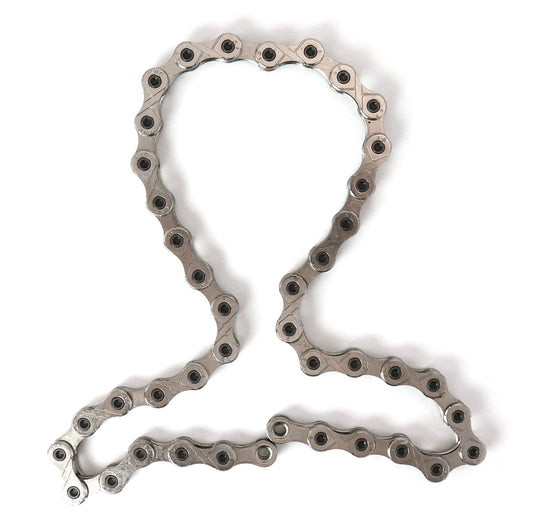 A silver 20-link bicycle chain for Hase Kettwiesel models with Suspension.