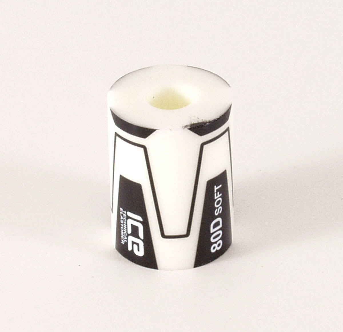 A replacement elastomer for an ICE Trike's rear suspension, with white color indicating the soft grade.