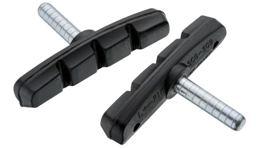 Jagwire Mountain Sport Brake Pads 70mm facing eachother, black brake pad and silver slide pin.