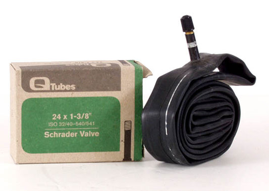 A black bicycle tube with a Schrader valve, next to its packaging box which is green and has the brand name 'Q Tubes' on it.