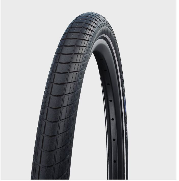 A black Schwalbe Big Apple bicycle tire, 24 x 2.0 inches in size, with a textured tread pattern.