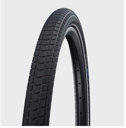 A black Schwalbe Big Ben Plus bicycle tire with a wired bead and GreenGuard sealant, designed for 26-inch wheels.