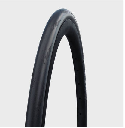 A black folding tire for a road bicycle, with visible tread pattern and sidewall details.