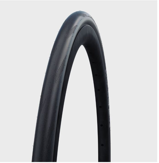 A black folding tire for a road bicycle, with visible tread pattern and sidewall details.