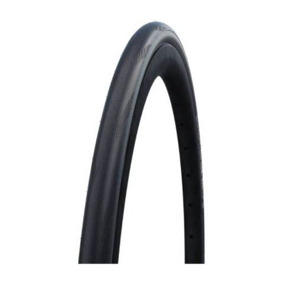 A black Schwalbe One tubeless folding bicycle tire with a visible tread and sidewall information.