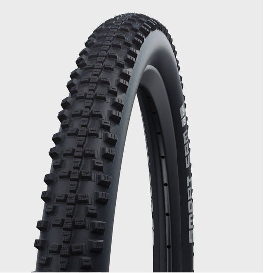 A black mountain bike tire with distinctive off-road tread pattern, branded Schwalbe.