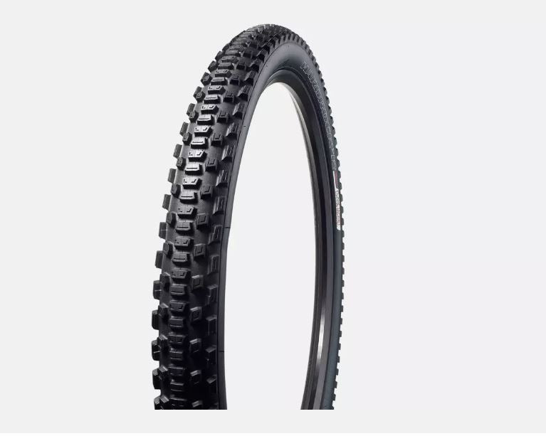 A black cycling tire with a textured tread pattern, designed for 650b bikes.