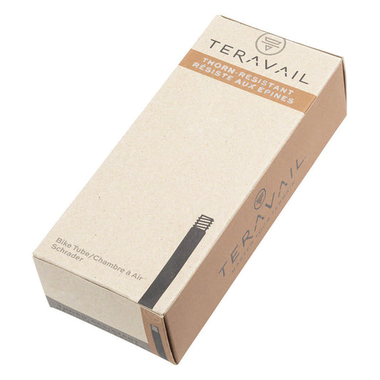 A packaged Teravail Thorn Resistant Schrader Valve Tube, with branding and product information visible on the box.