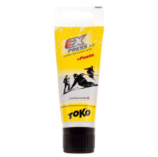 A tube of Toko Express Paste Wax with a sponge applicator, primarily yellow with brand and product information.