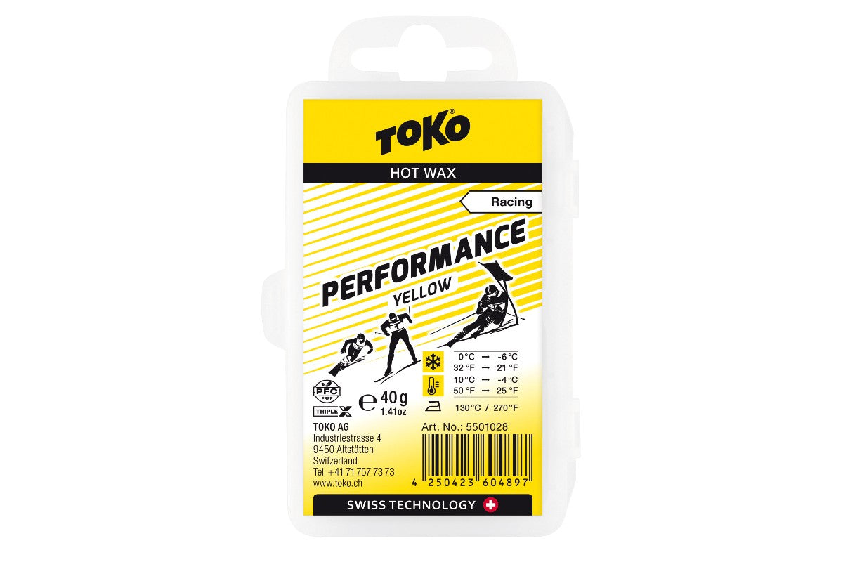A package of TOKO Performance Racing Hot Wax in a resealable wax case with blue and yellow design elements.