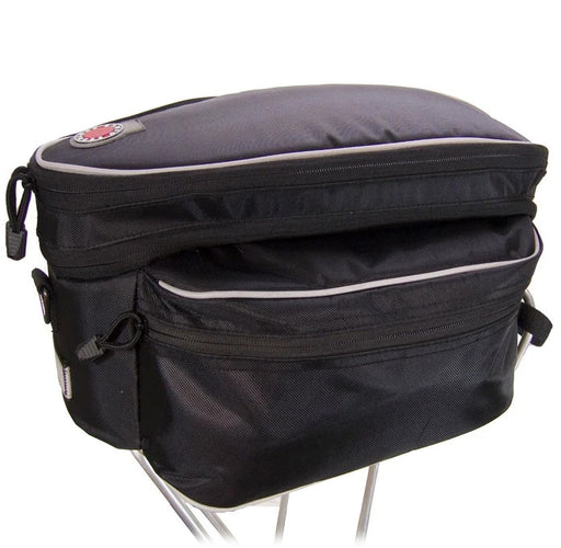 Studio image of Banjo Brothers Expanding Rack Top Bag Black bike rack bag showing top of bag expanded.  Bag is black with silver reflective trim on top and sides