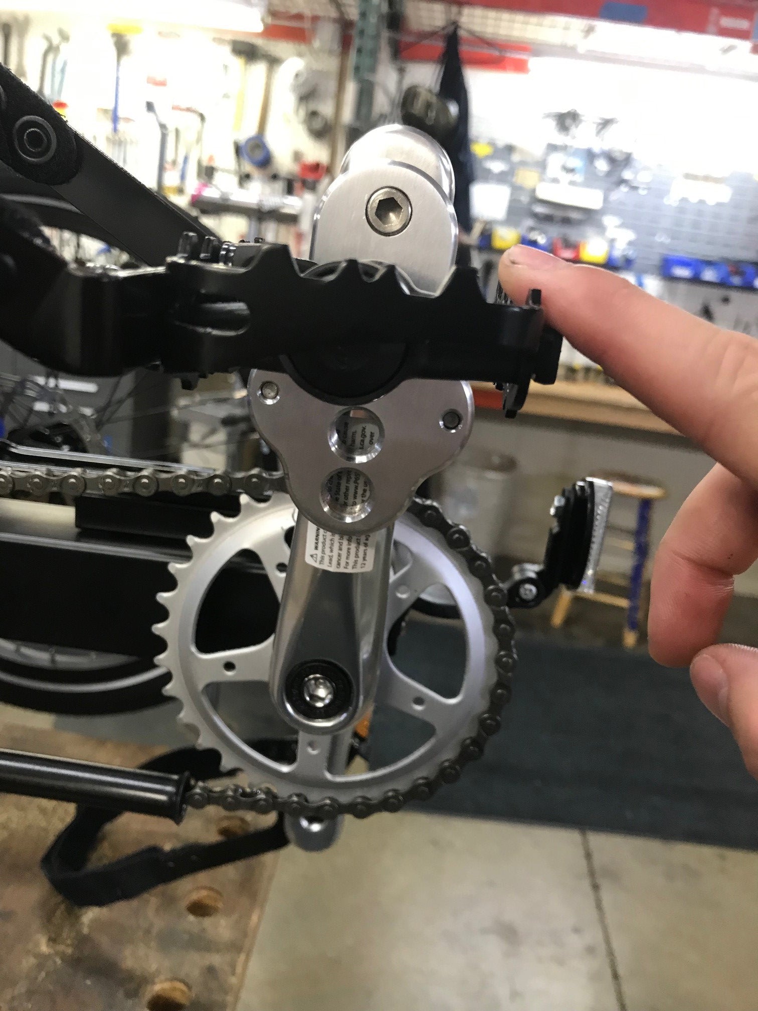 CJ Ackley Machine Company Crank Arm Shorteners Individual mounted on crank arm with a pedal installed.