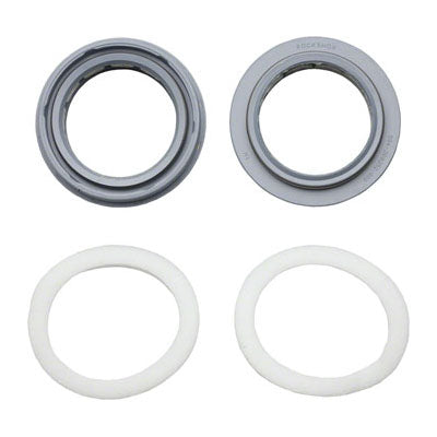 Two dust seals and foam rings for bicycle suspension, one in gray and one in white, displayed against a clean background.