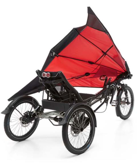 The red Hase Foldable Fairing is mounted on a Hase Trigo delta recumbent trike against a white background. It is shown in the open position for rider mounting.