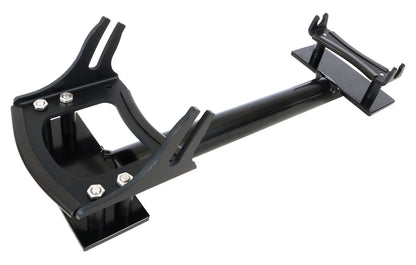 Angled view of the HP Velotechnik Scorpion Assembly Mount Workstand Bracket, primarily black in color, designed to clamp onto a trike for workshop maintenance, against a white background.background.