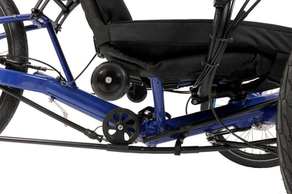 Closeup side view of the HP Velotechnik Gekko fx 26 Comfort Recumbent Trike in Deep Blue against a white background. Image shows chain idler, base of seat, and small wheels on seat base used to roll the trike when folded. 