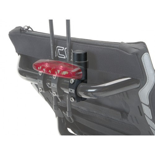 View of the ICE Seat Rail Light Mount in black with a white ICE logo mounted on the back of the seat on an ICE recumbent trike against a white background.