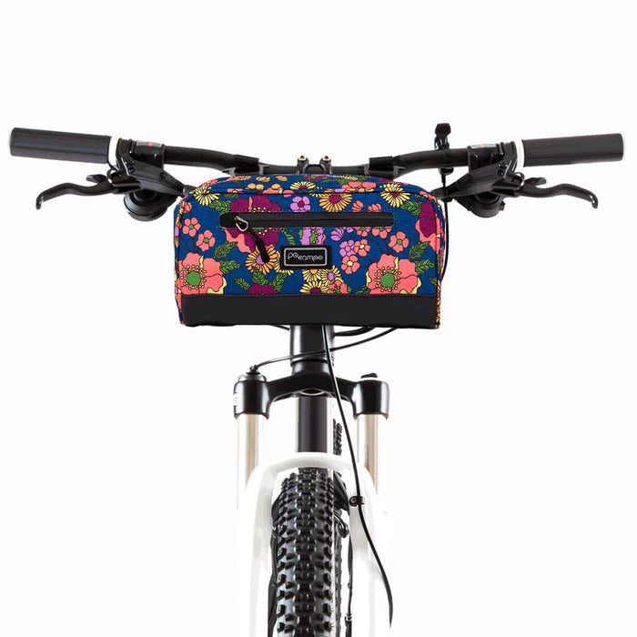 Front side of the meadow domino handlebar bag mounted onto the handlebars and head tube of a bike.