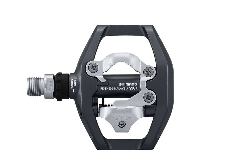 Bottom view of the Shimano PD-EH500 Pedals which features a silver Shimano clip on this side.  The pedal is black with a silver spindle and has the Shimano logo on it in white.