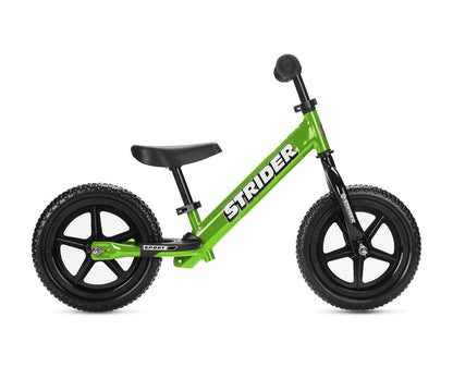 Green Strider Sport Kids Balance Bike with black wheels and a black seat, designed for children.