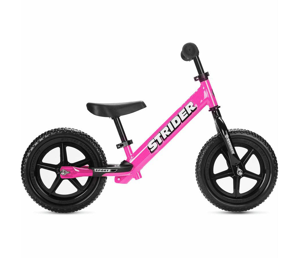 Pink Strider Sport Kids Balance Bike with black wheels and a black seat, designed for children.